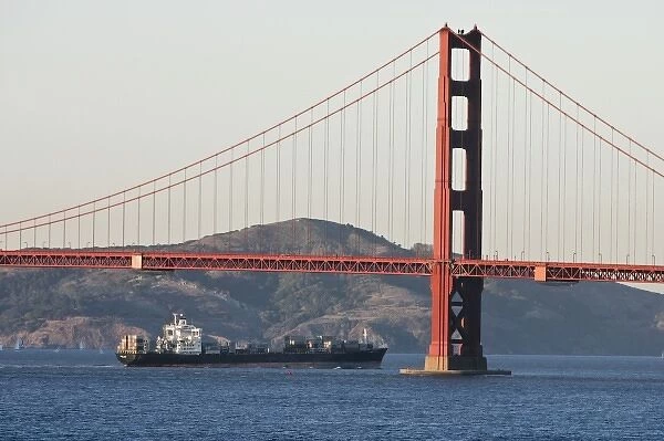 A container ship passes under the Golden Gate Bridge entering San Francisco Bay