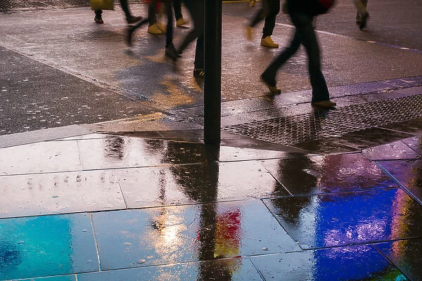 England, London, Soho, Piccadilly Circus, wet sidewalk reflections