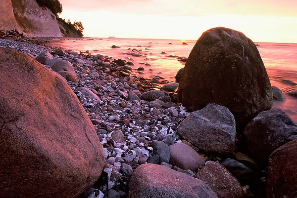 EUROPE, Germany, Baltic Sea, Island of Ruegen Rocky coastline in rosey sunrise