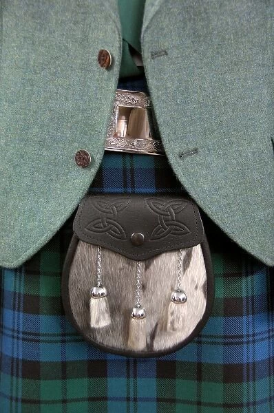 Europe, Scotland. Classic Scottish tartan attire with sporran (pouch or bag). THIS