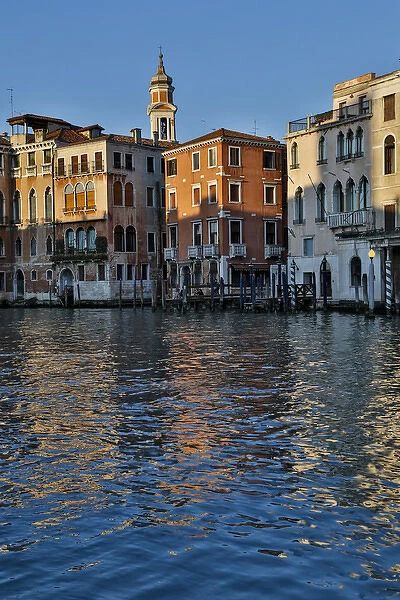 Evening light on Grand Canal and its reflection of old buildings and belltower, Venice