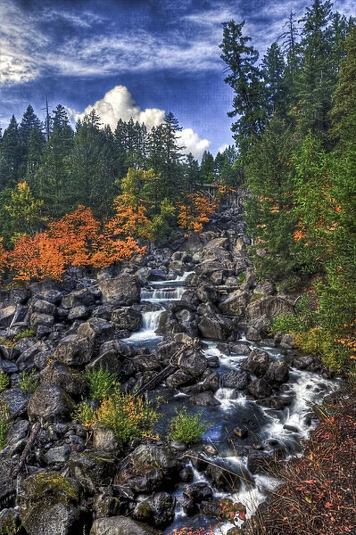 A fall scene of flowing water along the Empqua River in Steamboat Oregon