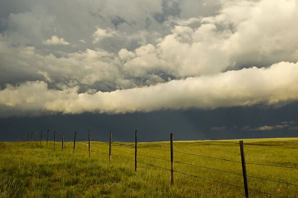 Fenceline during severe thunderstorm near Browning, Montana, USA