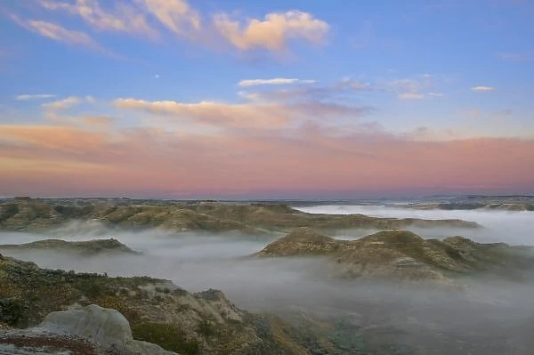 Fog from the Little Missouri River hangs in the badlands of Theodore Roosevelt National