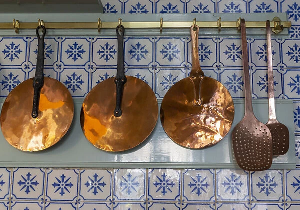 France, Giverny. Copper utensils in kitchen of Monets house