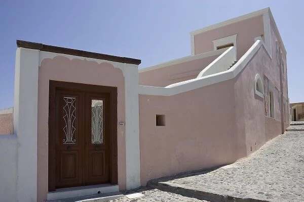 Greece, Santorini, Thira, Oia. Pink villa with wooden door