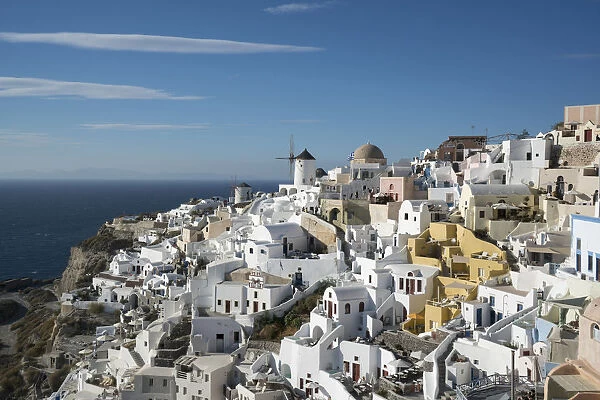 Greece, Santorini. The village of Oia glowing in the afternoon light