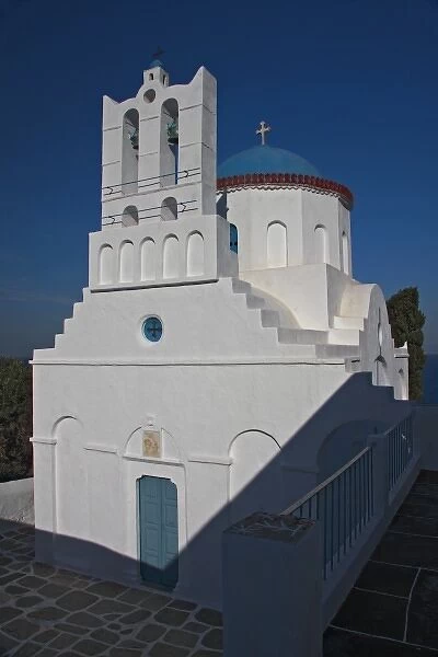 Greece, Sifnos. A traditional Greek Orthodox church reflects the afternoon autumn sun