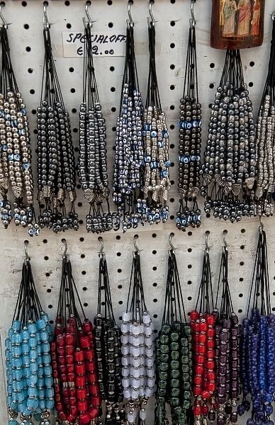 Greek souvenir beads on rack in downtown shopping area of Plaka, Athens, Greece
