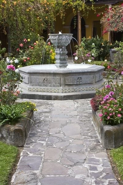 Guatemala, Antigua. Fountain and gardens in center courtyard of Antigua hotel