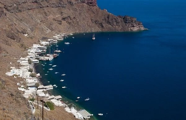 Harbor with boats in isolated village of Thirassia across from Santorini Greece in