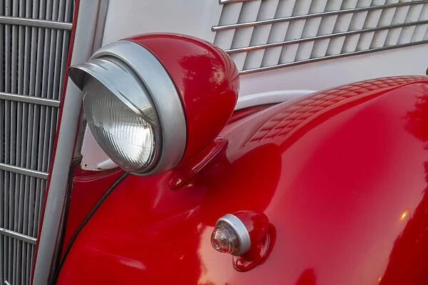 Detail of head lamp on red classic American Ford in Habana, Havana, Cuba
