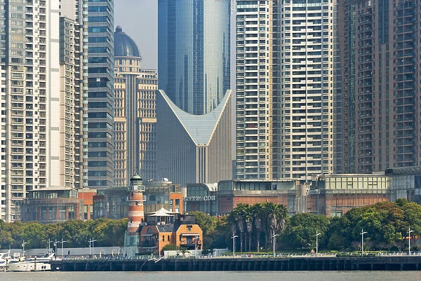 High-rise and light house by Huangpu River in Pudong, Shanghai, China