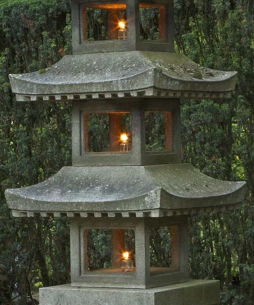 Illuminated stone pagoda lantern in Portland Japanese Garden