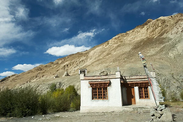 India, Ladakh, Markha Valley, old woman with ripples in front of typical ladakhi house