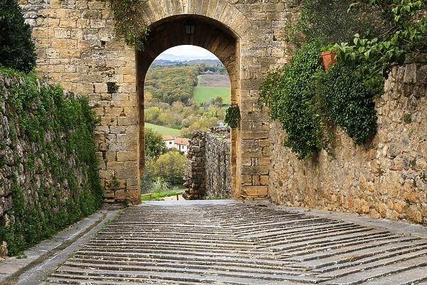 Italy, Monteriggioni. Arched exit-way through city walls