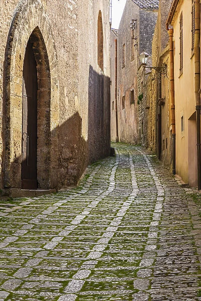 Italy, Sicily, Trapani Province, Erice. A narrow cobblestone street in the ancient hill