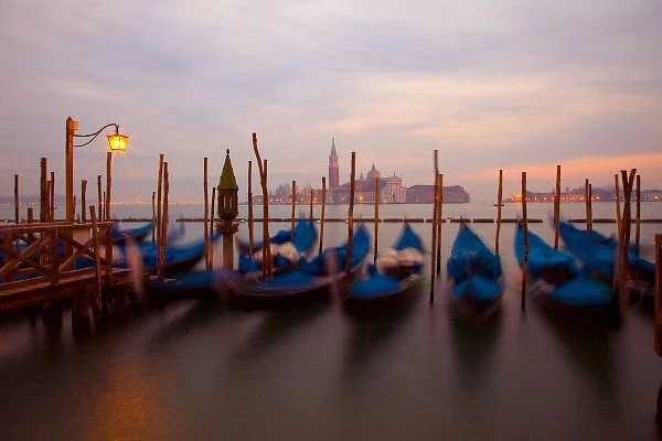 Italy, Venice. Anchored gondolas at twilight. Credit as: Jim Zuckerman  /  Jaynes Gallery