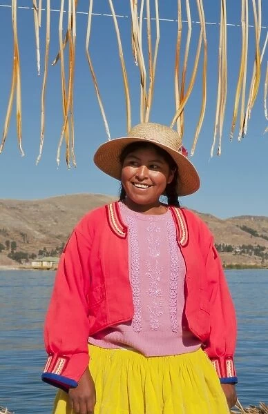 Lake Titicaca Peru with local traditional woman of Uros Tribe history in colorful