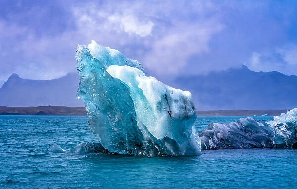 Large iceberg Diamond Beach, Jokulsarlon glacier lagoon, Vatnajokull National Park