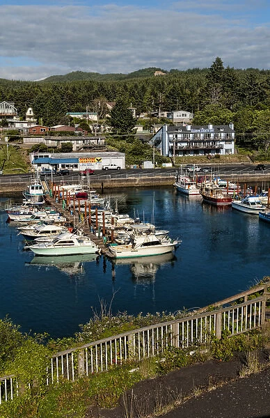 Looking down from above at Depoe Bay Oregon harbor with scenic colorful boats in pier