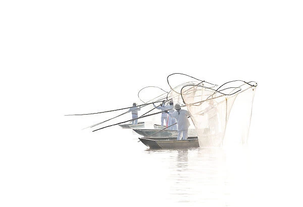 Mexico, Lake Pazcuaro. Butterly fisherman casting nets
