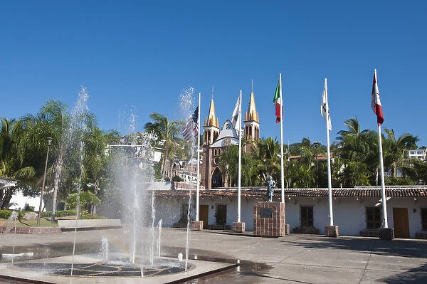 Mexico, Puerto Vallarta. Park Hidalgo with Iglesio del Rexugio, Puerto Vallarta, Mexico