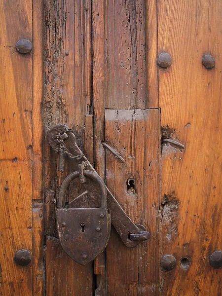 Mexico, San Miguel de Allende. Padlock on wooden door