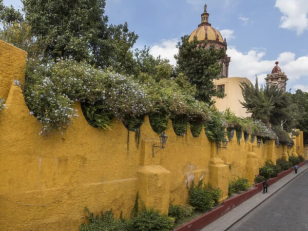 Mexico, San Miguel de Allende. Yellow wall outside church