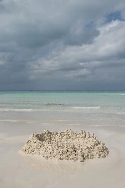 Mexico, Yucatan, Isla Mujeres (Island of Women), sand castle on beach and Caribbean Sea