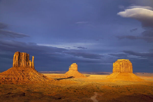 The Mittens and Merrick Buttes at sunset in Monument Valley Navajo Tribal Park on the Arizona
