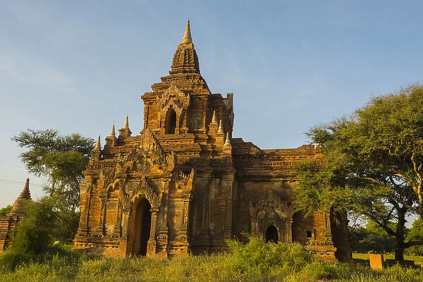 Myanmar. Bagan. Red brick temple glows in the late afternoon light
