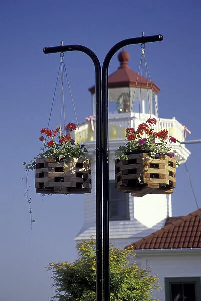 NA, USA, Washington, Mukilteo Hanging flower baskets and the Mukilteo Lighthouse
