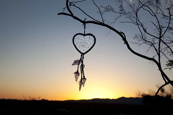 Native American heart shaped dreamcatcher at early morning sunrise
