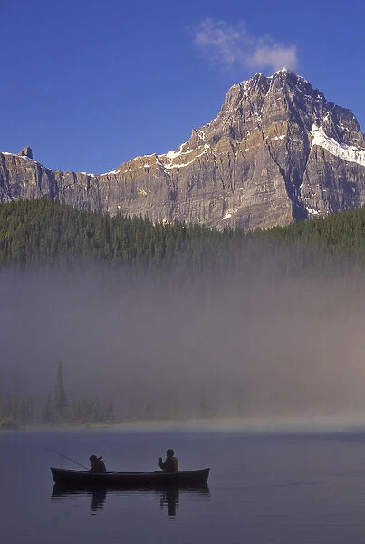 North America, Canada, Alberta, Baniff National Park. Silhouette of two boys in