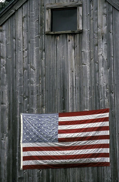 North America, United States, New England. American Flag on barn