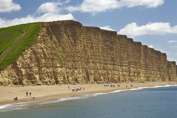 People on beach by West Bay Cliffs, Jurassic Coast World Heritage Site, West Bay