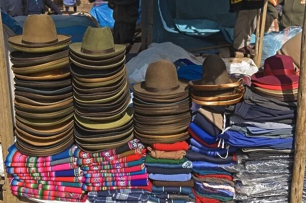 Peru, Pisac, Hats and clothes for sale at market