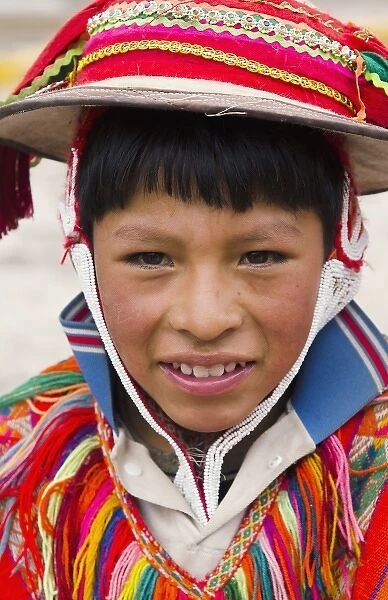Portrait of young boy, with traditional dress in small town of Pisaq Peru South America