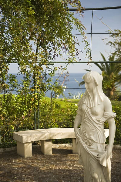 small statue in rose garden. Coast of France between Villefranche and Monaco