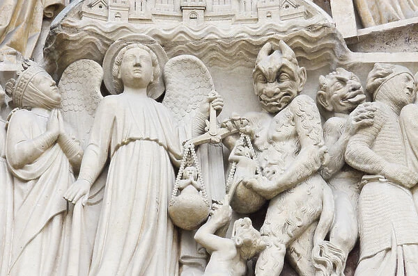 Statues depicting the judgement of souls, exterior of Notre Dame cathedral, Paris, France