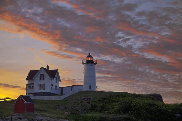 Sunrise skies over Nubble aka Cape Neddick Lighthouse in York, Maine, USA