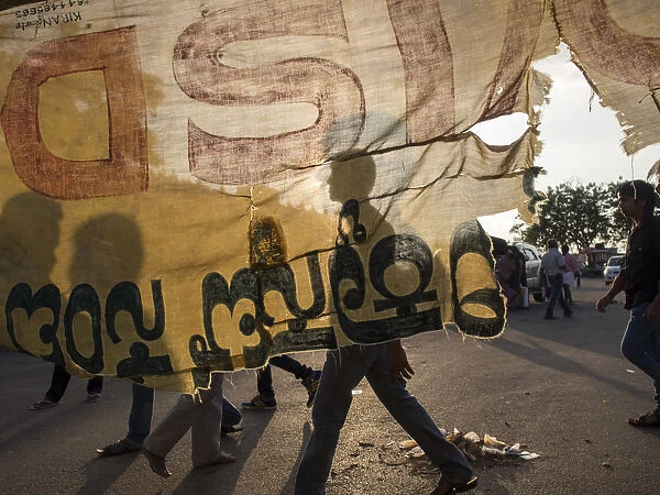 Torn cloth banner and street scene in Mysore, Karnataka, India