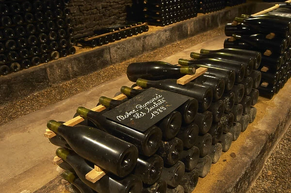 In the underground wine cellar: a pile of bottles of Vosne Romanee Romanee Les Suchots
