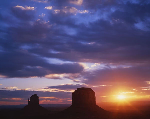 USA, Arizona, Monument Valley. Sunrise on large sandstone formations. Credit as