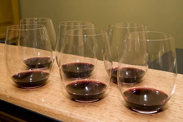 USA, California, Napa Valley. Six glasses of red wine poured for tasting. Credit as