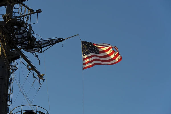 USA, California, San Diego. The American flag flies on board the USS Midway in San Diego