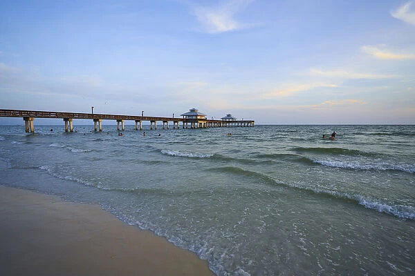 USA, Florida, Fort Myers Beach. Fort Myers Beach Pier at sunset
