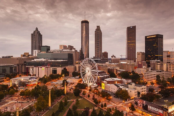 USA, Georgia, Atlanta, Centenial Olympic Park, elevated city view with ferris wheel, dusk