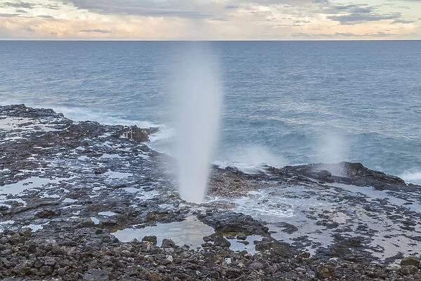 USA, Hawaii, Kauai. Spouting Horn spray and ocean